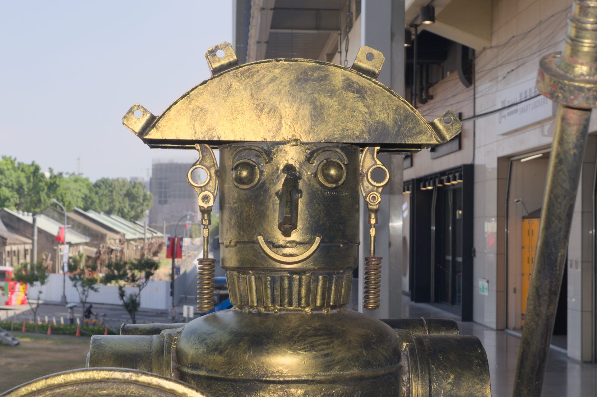 Brass robot sculpture on a Taichung street