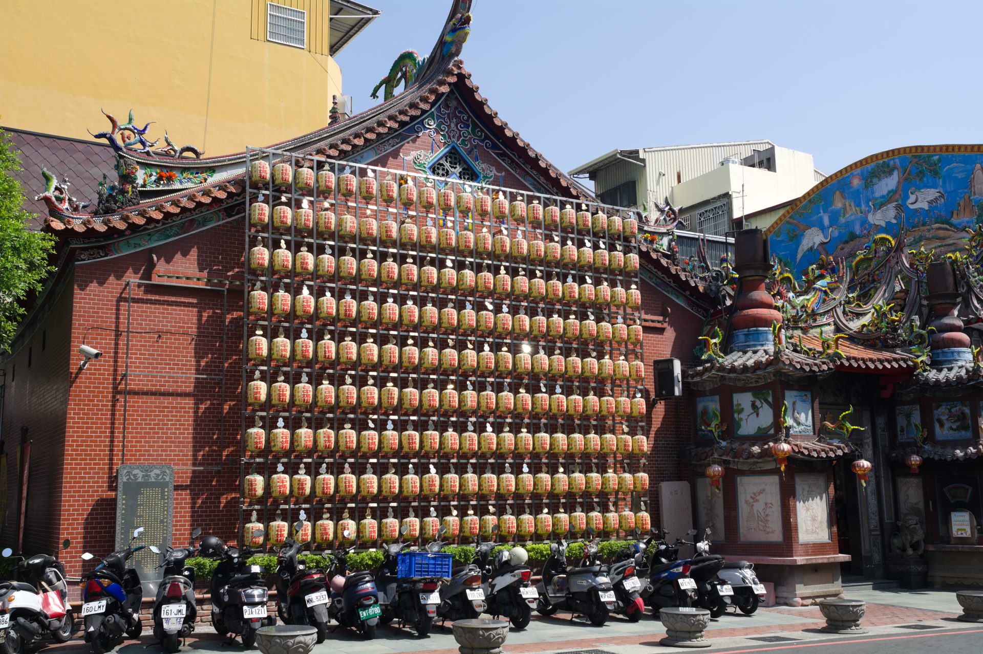 Temple wall hung with rows of lanterns